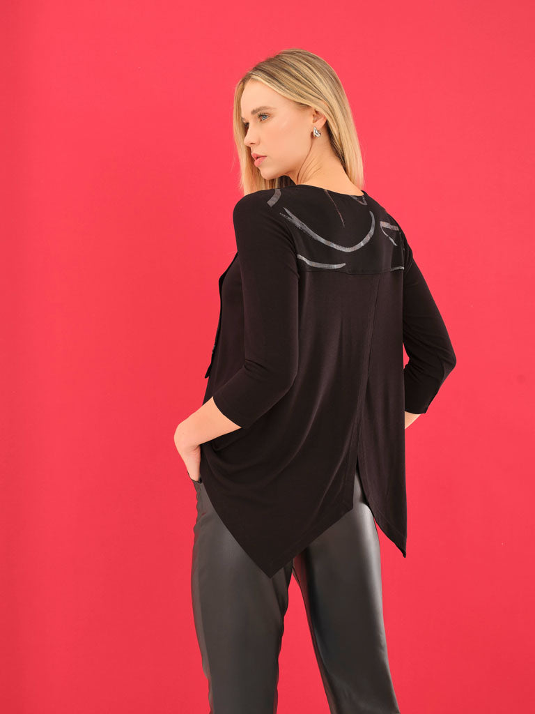 Woman wearing a black outfit with decorative elements on a red background