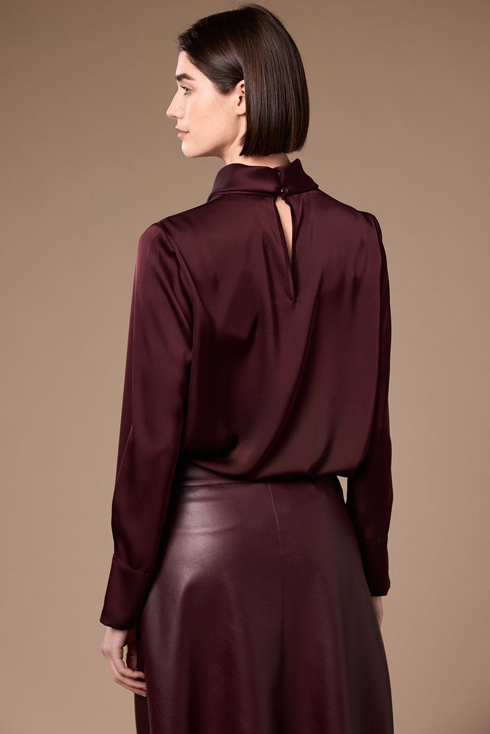 Peruzzi Twist Neck Blouse