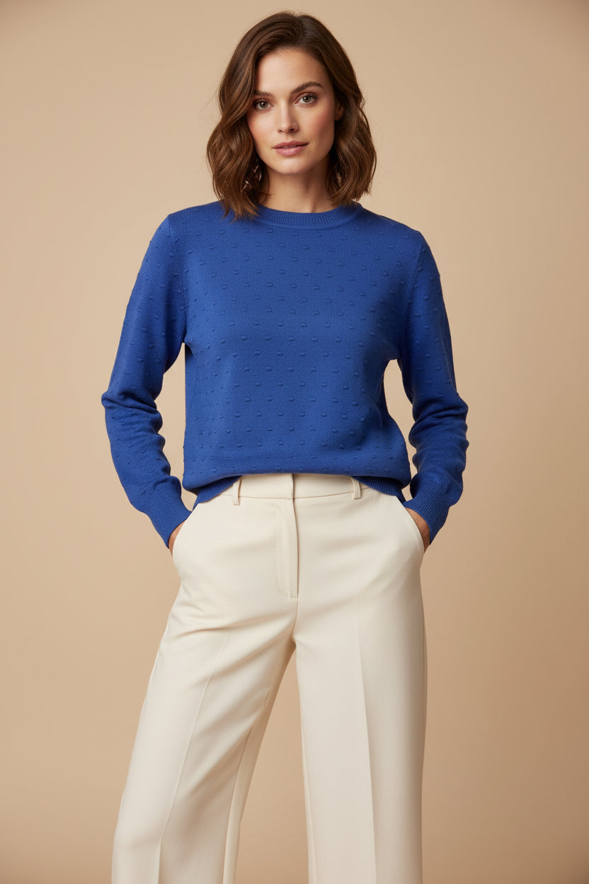 A royal blue textured knit sweater with a raised dotted pattern