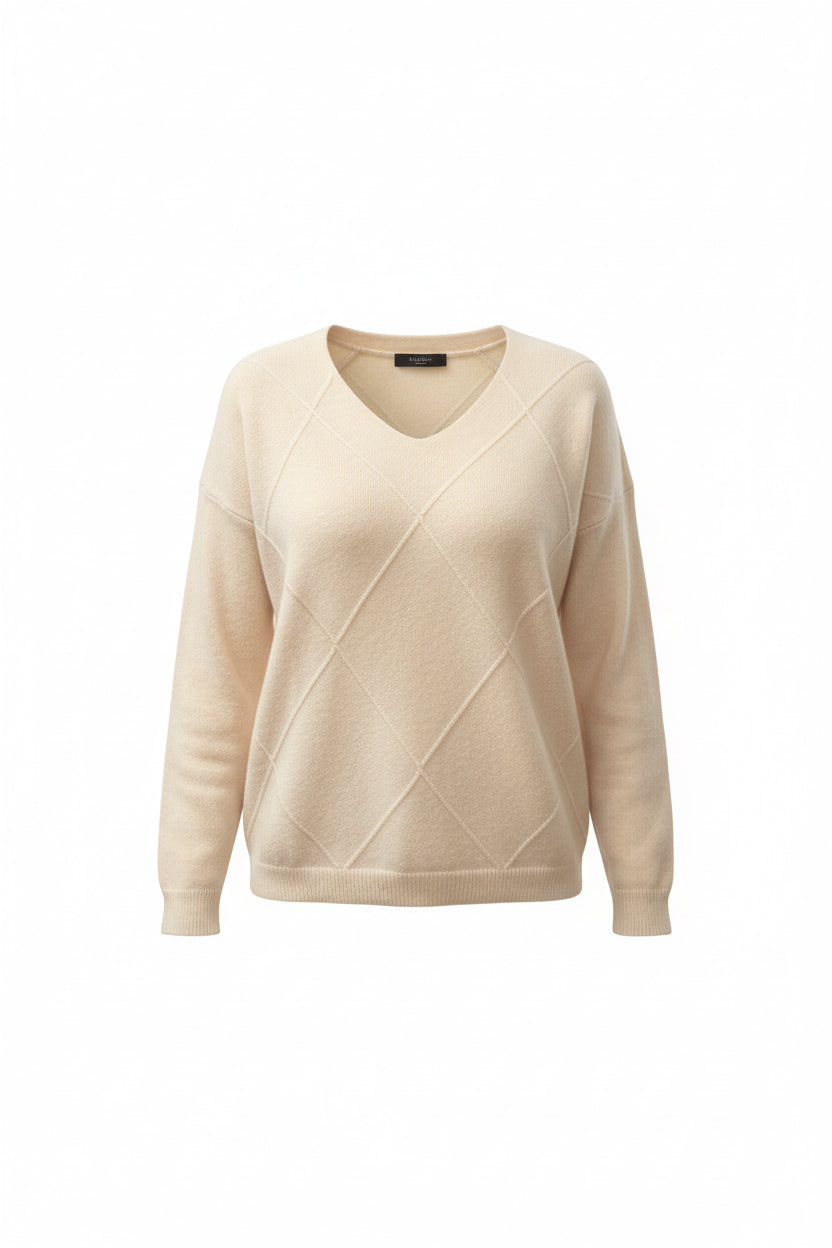 Cream-colored knit sweater with a diamond pattern 