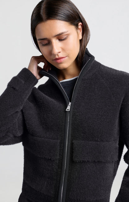 Knitted black coat with long sleeves, zipper and pockets